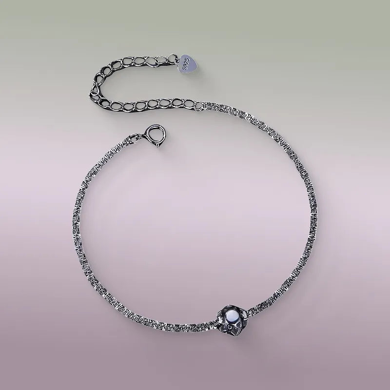 Delicate 1ct moissanite adjustable bracelet on wrist, showcasing thin silver chain