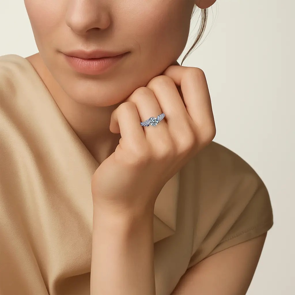 Hand wearing a moissanite engagement ring in solid sterling silver, beside fresh garden roses